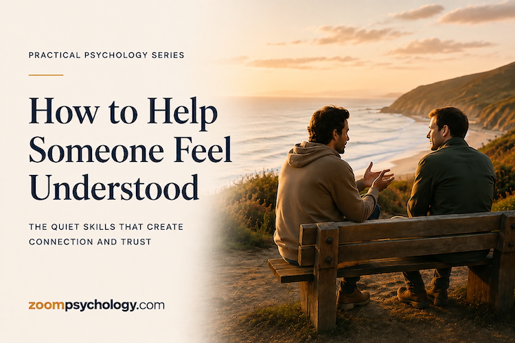 Two people sitting together overlooking the coastline, demonstrating attentive listening and supportive conversation.